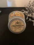 Calendula flowers in small herb bottle